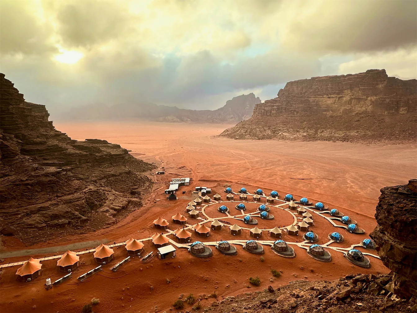 Aerial view of a luxury dome camp in Wadi Rum, part of an exclusive Private Jet Jordan experience